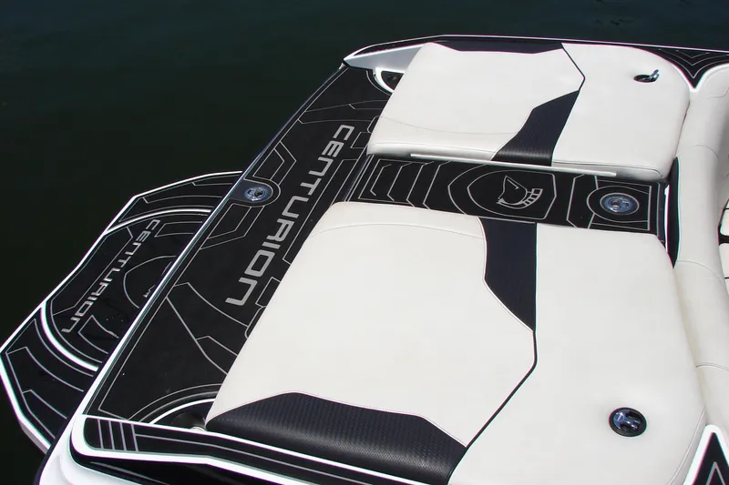 Slide: The Image of 2019 Centurion Ri257 boat deck with sleek black and white design. - 20