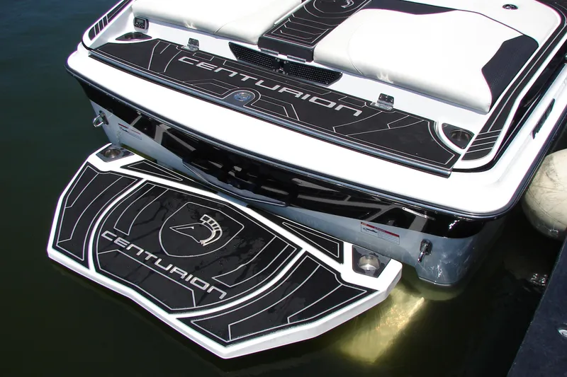 Slide: The Image of 2019 Centurion Ri257 boat rear view with branded swim platform and seating. - 21