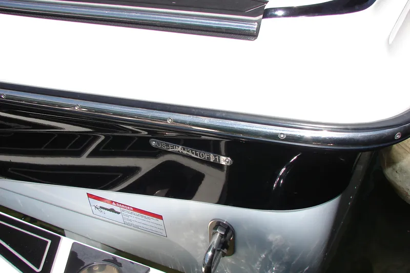 Slide: The Image of 2019 Centurion Ri257 boat stern with identification number and warning label. - 23