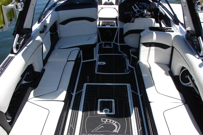 Slide: The Image of Luxurious interior of 2019 Centurion Ri257 boat with sleek black and white seating. - 24