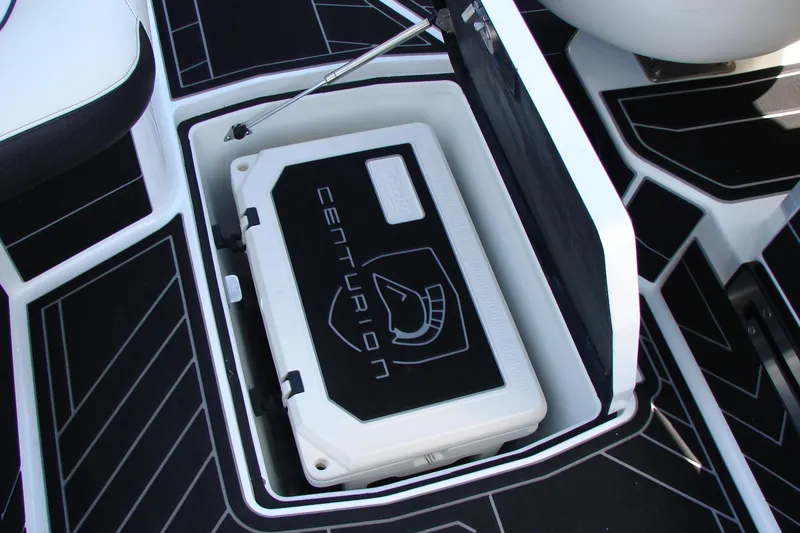 Slide: The Image of 2019 Centurion Ri257 boat storage compartment with branded cooler inside. - 30