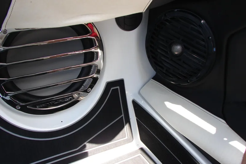 Slide: The Image of 2019 Centurion Ri257 boat interior with premium audio speakers and sleek design elements. - 36