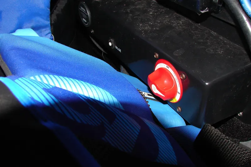 Slide: The Image of 2019 Centurion Ri257 boat interior with red power switch and blue fabric. - 46