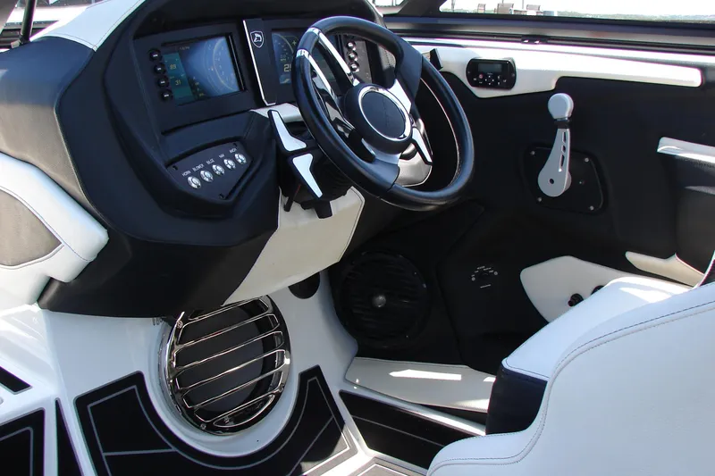 Slide: The Image of 2019 Centurion Ri257 boat interior with modern dashboard and steering wheel design. - 48