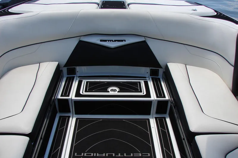 Slide: The Image of 2019 Centurion Ri257 boat interior with sleek white and black seating and flooring. - 53