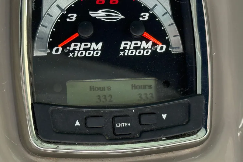 Slide: The Image of Close-up of 2016 Chaparral 290 Signature RPM gauge showing 332 and 333 hours. - 10