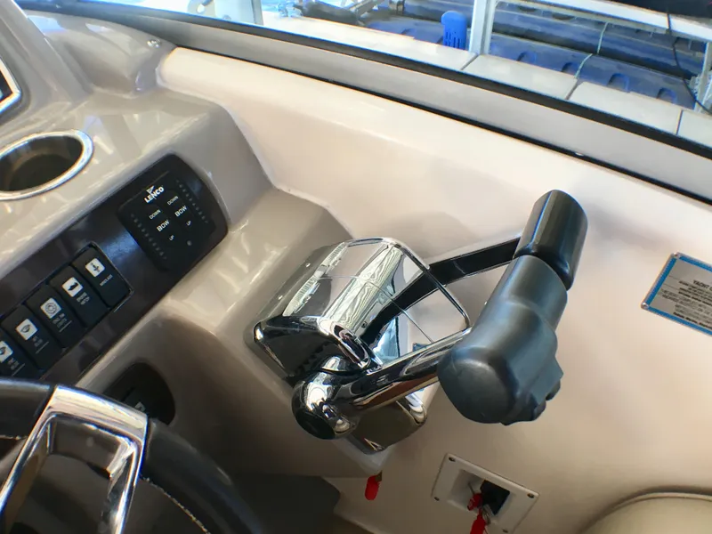 Slide: The Image of Control panel and throttle of 2016 Chaparral 290 Signature boat. - 11