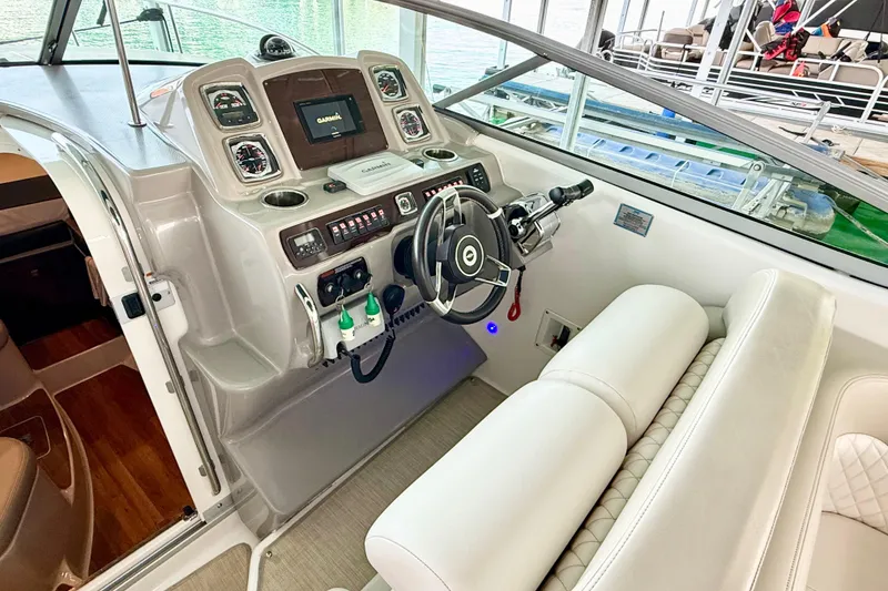 Slide: The Image of 2016 Chaparral 290 Signature boat helm with Garmin navigation system and plush seating. - 12