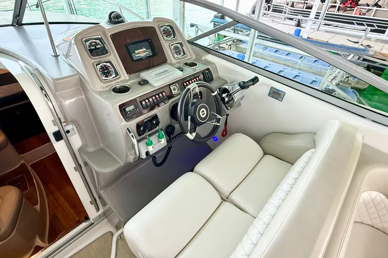 Slide: The Image of 2016 Chaparral 290 Signature boat helm with modern controls and comfortable seating. - 13