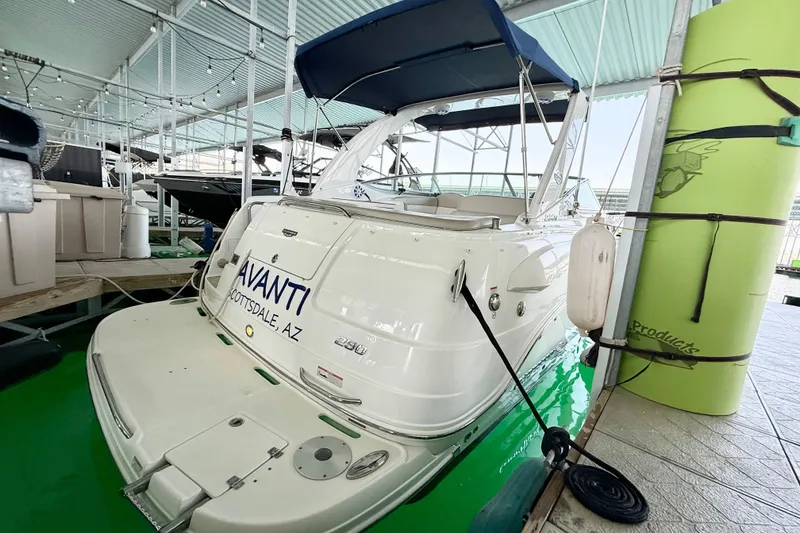 Slide: The Image of 2016 Chaparral 290 Signature boat docked with blue canopy and Scottsdale, AZ label. - 2