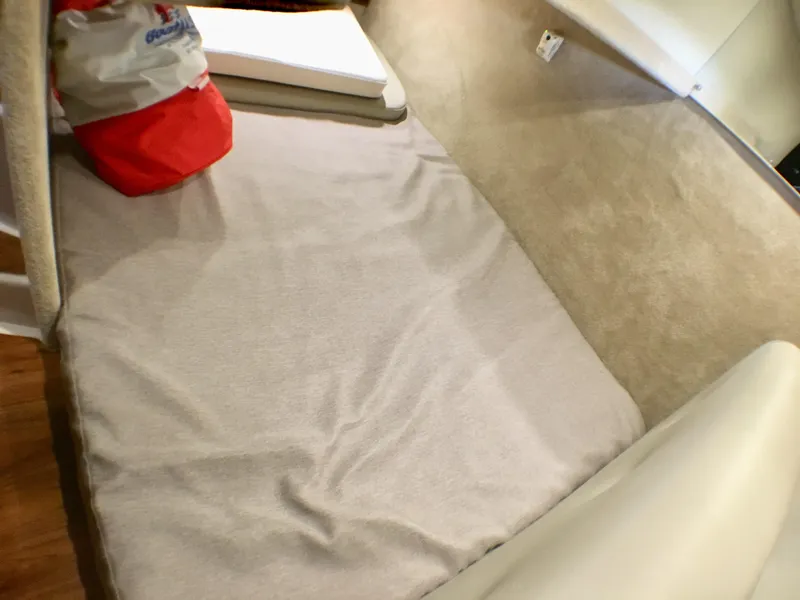 Slide: The Image of 2016 Chaparral 290 Signature cabin interior with cushions and storage bag. - 23