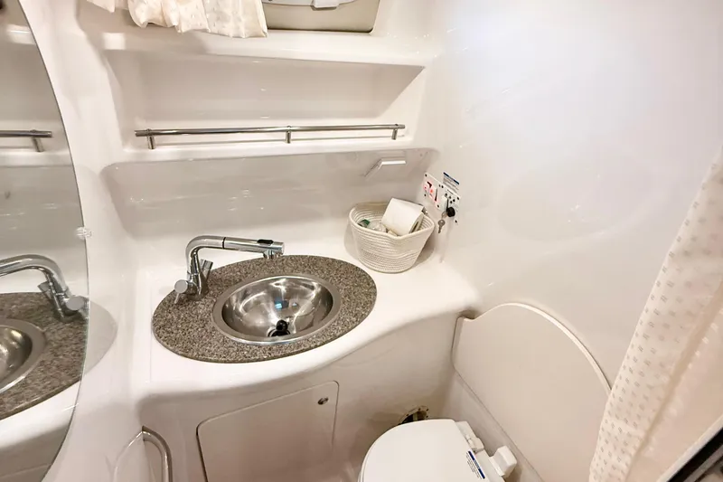 Slide: The Image of 2016 Chaparral 290 Signature bathroom with sink, mirror, and toilet. - 28