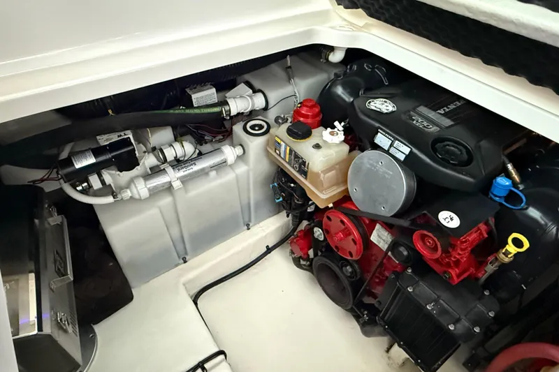 Slide: The Image of Engine compartment of 2016 Chaparral 290 Signature boat, showcasing detailed mechanical components. - 30