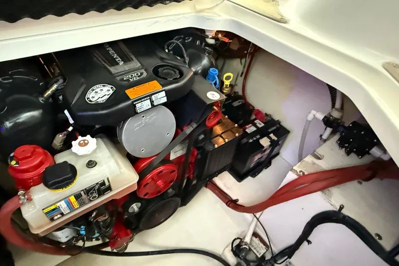 Slide: The Image of Engine compartment of 2016 Chaparral 290 Signature boat, showcasing mechanical components. - 31