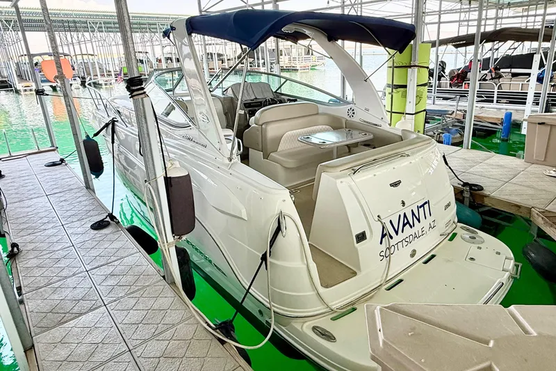 Slide: The Image of Chaparral 290 Signature 2016 boat docked, featuring spacious seating and covered canopy. - 38