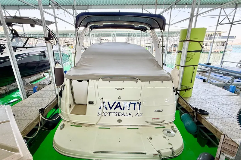 Slide: The Image of 2016 Chaparral 290 Signature boat docked, covered, with "Avanti Scottsdale, AZ" text on the stern. - 39
