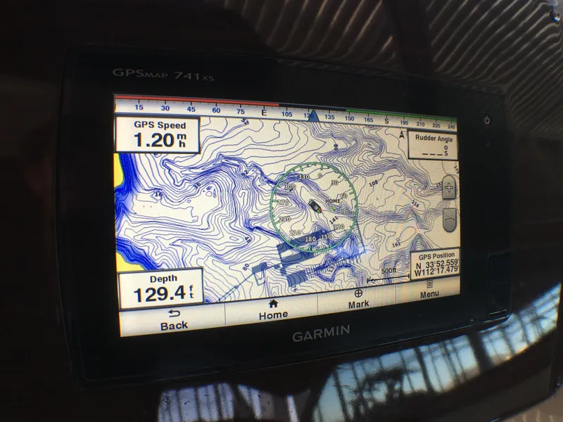 Slide: The Image of Garmin GPS display on 2016 Chaparral 290 Signature showing speed, depth, and map details. - 46