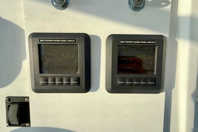 Slide: The Image of SMX Seaview marine diesel displays on 1979 Bertram 35 Flybridge boat. - 17