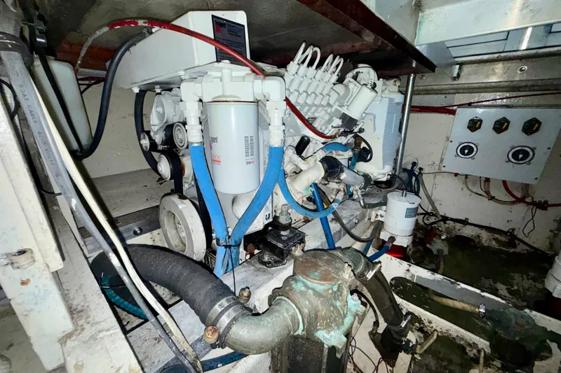 Slide: The Image of Engine room of a 1979 Bertram 35 Flybridge with visible mechanical components. - 41