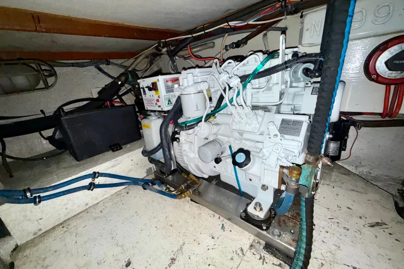 Slide: The Image of Engine room of a 1979 Bertram 35 Flybridge boat, showcasing mechanical components. - 43