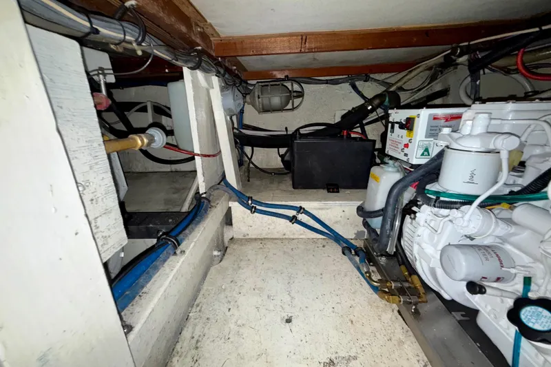 Slide: The Image of Engine room of a 1979 Bertram 35 Flybridge boat, showing mechanical components. - 44