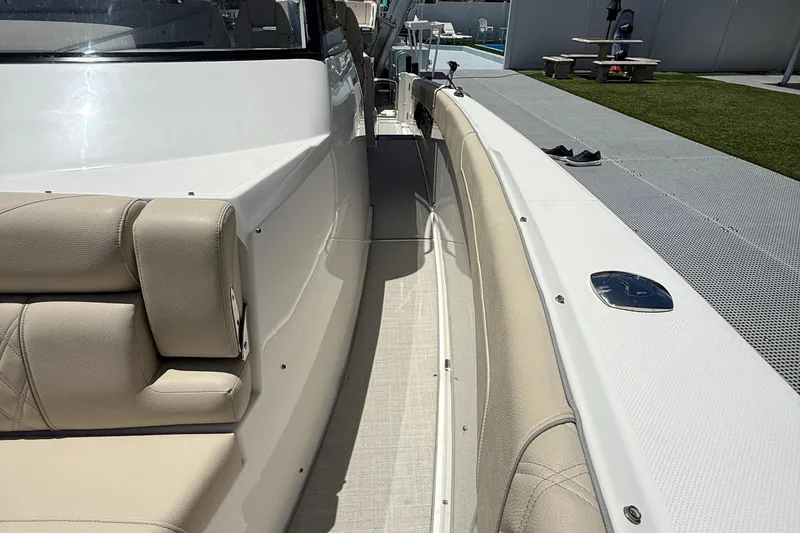 Slide: The Image of 2022 Regal 38 SAV boat interior with beige seating and sleek design. - 13