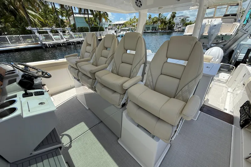 Slide: The Image of Luxurious seating on 2022 Regal 38 SAV boat, featuring plush, ergonomic design. - 14