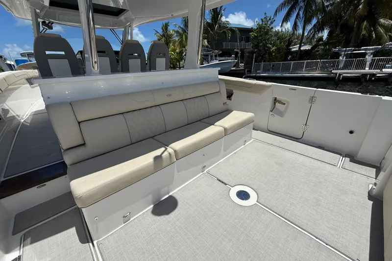 Slide: The Image of 2022 Regal 38 SAV boat interior with beige seating and modern design. - 17