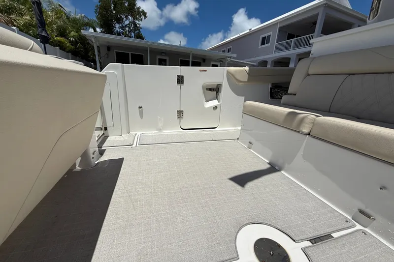 Slide: The Image of 2022 Regal 38 SAV boat interior with beige seating and open deck space. - 19