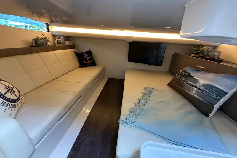 Slide: The Image of Luxurious interior of 2022 Regal 38 SAV yacht with cozy seating and modern decor. - 22