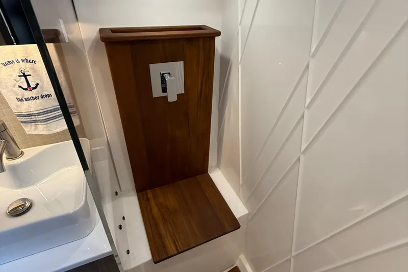 Slide: The Image of 2022 Regal 38 SAV bathroom with wooden panel and modern sink design. - 24