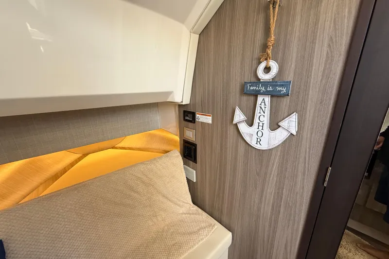 Slide: The Image of Cozy interior of 2022 Regal 38 SAV with anchor decor and warm lighting. - 26