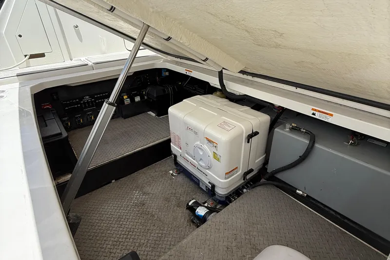 Slide: The Image of 2022 Regal 38 SAV engine compartment with equipment and storage space. - 31