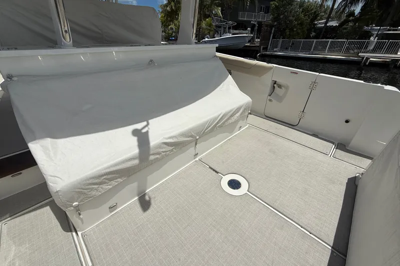 Slide: The Image of 2022 Regal 38 SAV boat deck with covered seating and clean flooring. - 34