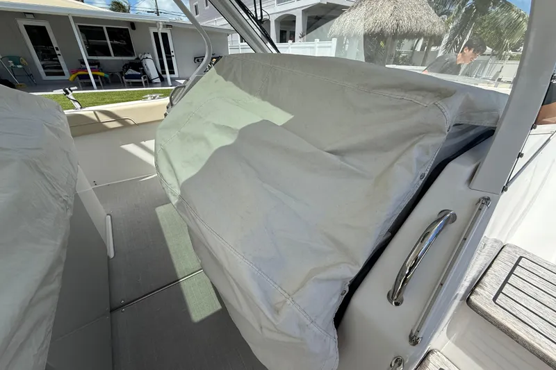 Slide: The Image of 2022 Regal 38 SAV boat interior with covered seating area. - 37