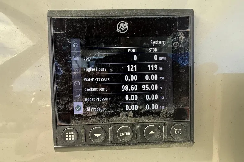 Slide: The Image of Display screen of a 2023 Boston Whaler 330 Outrage showing engine metrics. - 17