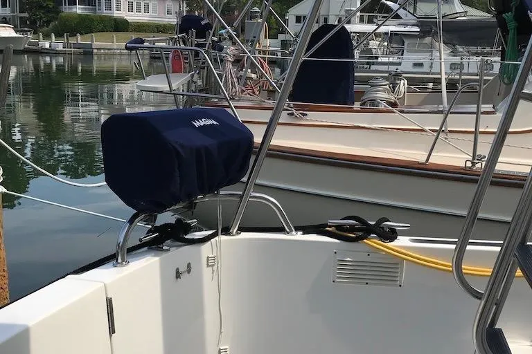 Slide: The Image of Cockpit on 2005 Nordic Tug 37 Flybridge featuring Magma propane grill and transom door to swim platform - 10