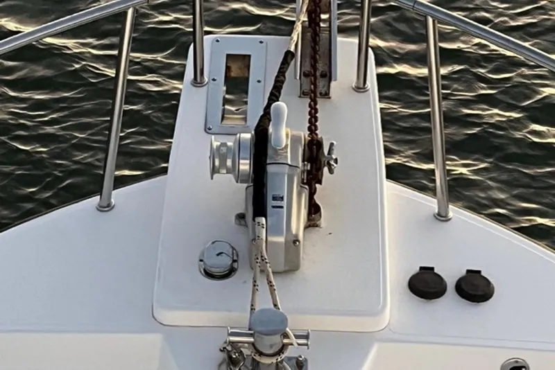 Slide: The Image of Bow Pulpit of 2005 Nordic Tug 37 Flybridge with anchor winch, 2 chutes, Samson post, foot controls and stainless steel railing - 17