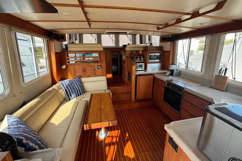 Slide: The Image of Interior of 2005 Nordic Tug 37 Flybridge with kitchen and seating area. - 21