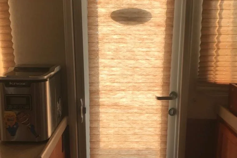 Slide: The Image of Interior of 2005 Nordic Tug 37 Flybridge with blinds and countertop appliance. - 30