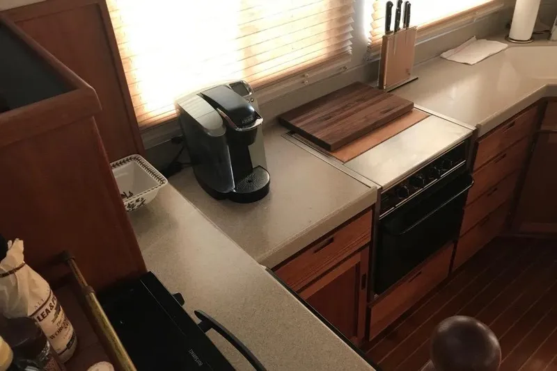Slide: The Image of Galley kitchen in 2005 Nordic Tug 37 Flybridge with coffee maker and cutting board. - 32