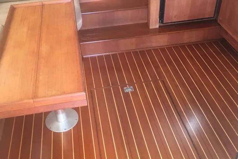 Slide: The Image of Interior of 2005 Nordic Tug 37 Flybridge with polished wooden flooring and seating. - 33