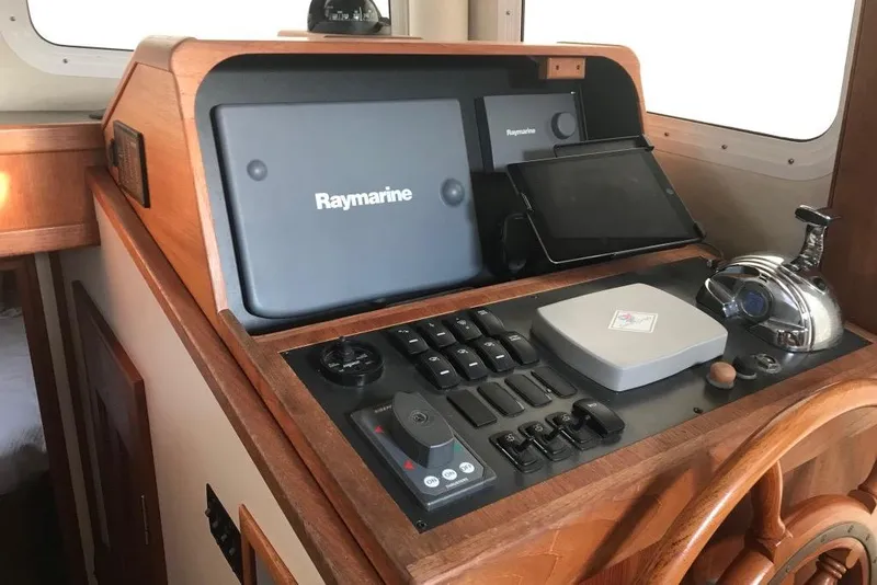 Slide: The Image of Lower Helm of 2005 Nordic Tug 37 Flybridge with navigation equipment, engine control, bow and stern thruster control.. - 39