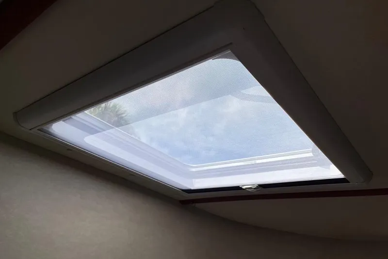 Slide: The Image of Oceanair style cover with screen pulled under Bomar opening Hatch - 52