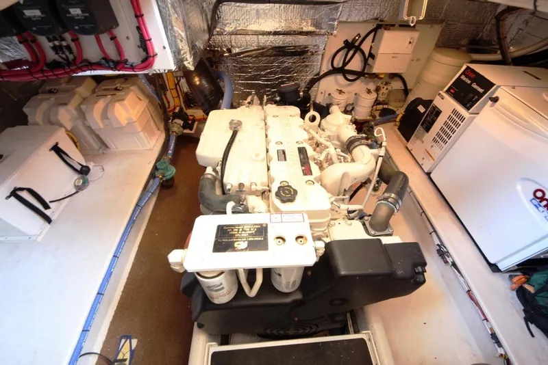 Slide: The Image of Engine room of 2005 Nordic Tug 37 Flybridge with visible machinery and equipment. - 61