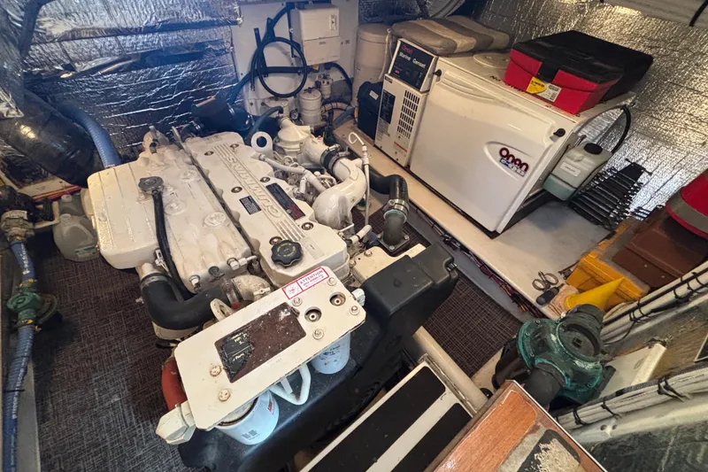 Slide: The Image of Engine Compartment to port side on 2005 Nordic Tug 37 showing Onan Generator in sound box - 62