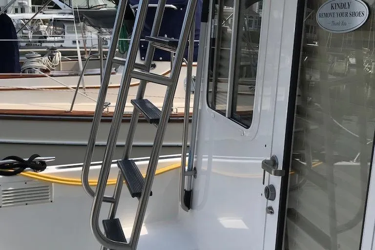Slide: The Image of 2005 Nordic Tug 37 Flybridge ladder to upper deck - 9
