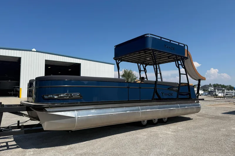 The Image of 2025 Tahoe Pontoon Cascade Cruise Funship with slide, parked outdoors under clear sky. - 0