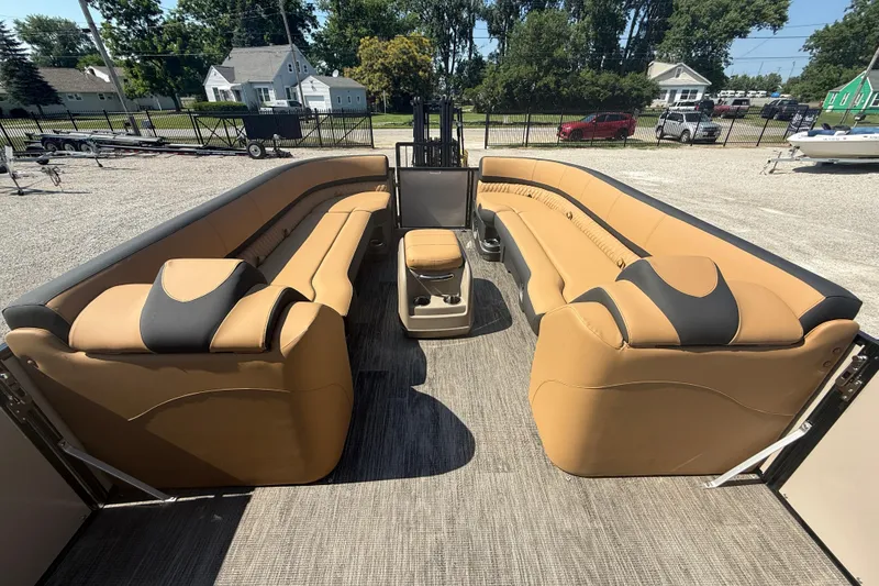 Slide: The Image of 2025 Tahoe Pontoon Cascade Cruise Funship with spacious tan seating and modern design. - 16