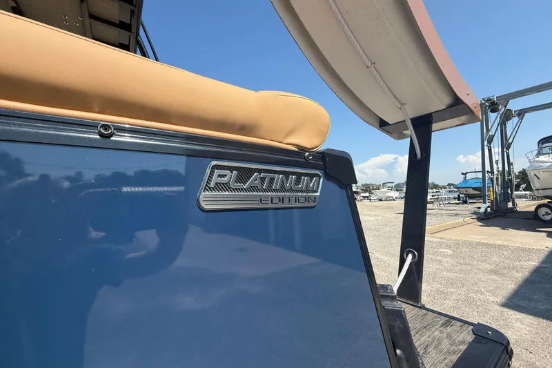 Slide: The Image of 2025 Tahoe Pontoon Cascade Cruise Funship, Platinum Edition, docked under clear blue sky. - 2